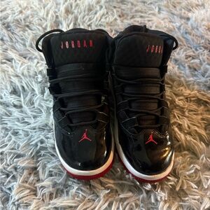 Like New Size 1.5 Jordan Kids Black Sneakers with Red Accents
